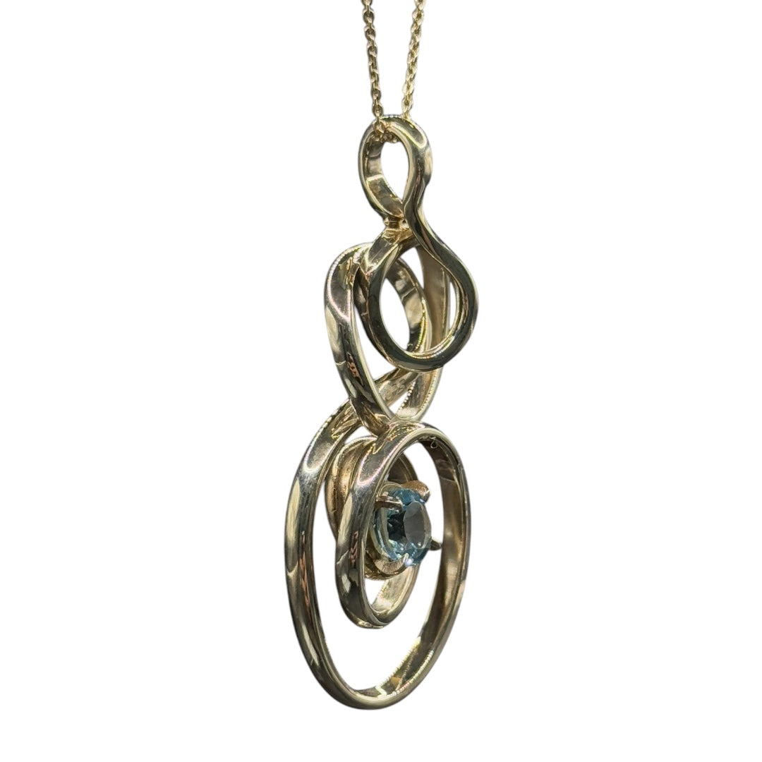 Silver pendant with topaz